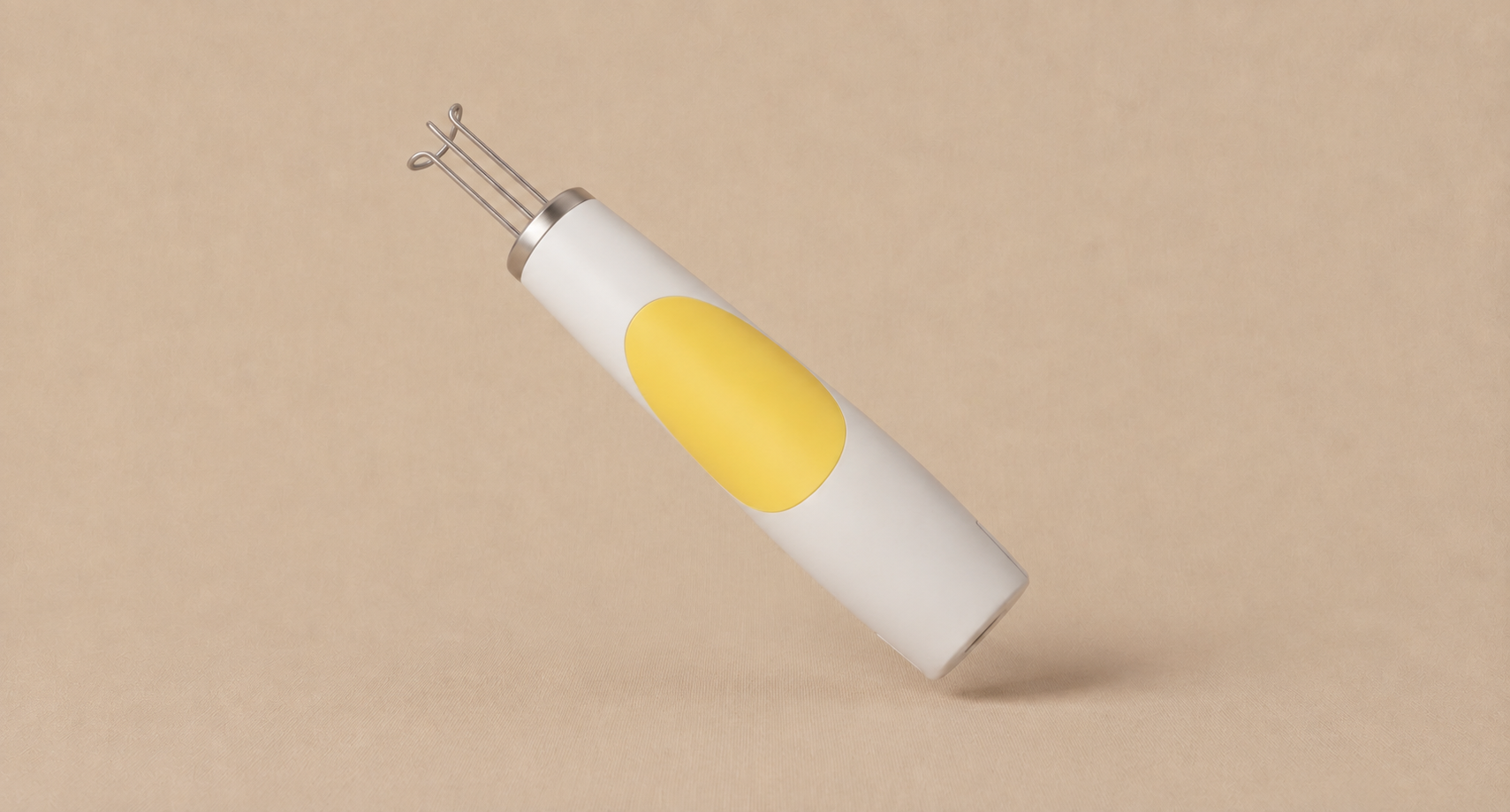 Tattoo removal treatment handpiece on a beige background