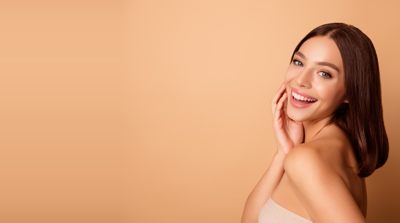 Woman with smooth, glowing skin after laser hair removal